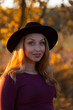 © Model Republic - Portrait of smiling beautiful young caucasian woman with long fair hair in hat outside on warm sunny day. Nature backsides. Back to basics concept. Relaxing, calm meditation concept