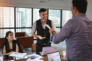 two caucasian businessmen holding success business certificate with happy and smiling face in modern office