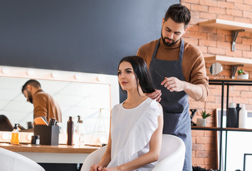 Canvas Print - Hairdresser working with client in salon