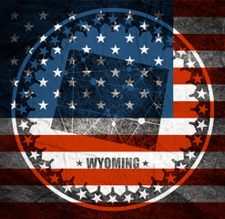 Wall Mural - Image relative to USA travel. Wyoming state map textured by lines and dots pattern. Stamp in the shape of a circle. Flag of the USA