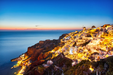 Wall Mural - Illuminated Oia Village at Sunset on Santorini Island