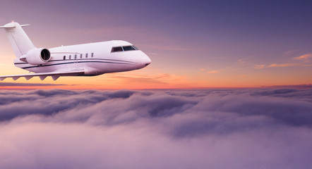 Small private jetplane flying above beautiful clouds. Travel and transportation concept.