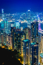 Night Time View Of Hong Kong And Kowloon Skyline As Seen From Victorial Peak