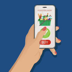 Online food delivery application concept. Female hand holding a smartphone with mobile app on classic blue background with supermarket basket full of grossery on screen. Vector illustration flat style