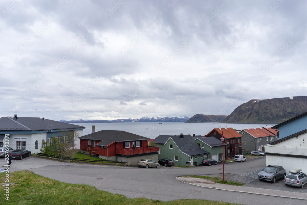 Port of Honningsvag in Finnmark Norway: base for the cruise ships and tourist as starting point for their trip to the North Cape the most northerly point of Europe. - obrazy, fototapety, plakaty 