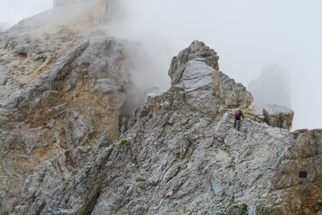 Wall Mural - Tourist with equipment on the via ferrata trail in the alps