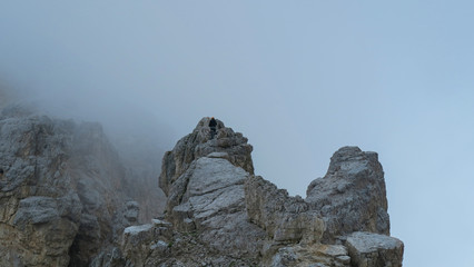 Wall Mural - Tourist with equipment on the via ferrata trail in the alps