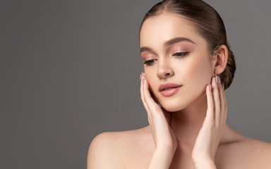 beautiful young woman with clean fresh skin on face . girl facial treatment . cosmetology , beauty a