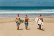 © Lennart - Three guys walking to the beach with surfboards and Santa hats