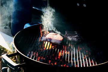 Wall Mural - steaks on the hot weber grill