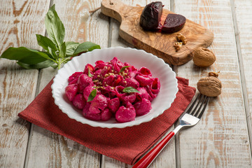 Sticker - pasta with beet pesto nuts and basil