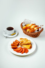 Canvas Print - fried sausages sausage and pancake plate black tea and breakfast for breakfast