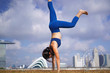 © 1000words - Sporty Asian Chinese Female Yoga practioner exercising under the sun