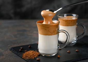 Two glass cups with Dalgona frothy coffee trend korean drink latte espresso with coffee foam