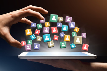 Poster - Hand takes people icons from tablet, collage
