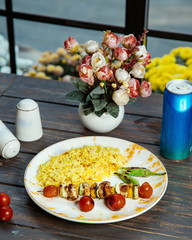 Canvas Print - rice dish plate with skewer of grilled chicken pepper zucchini and tomatoes