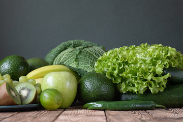 Wall Mural - Fruits and vegetables wooden table dark background