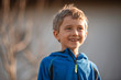 © Dziurek - Portrait of the smailing cute 7 years old boy with afternoon sunlight on his face