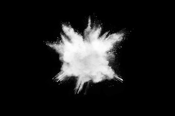 Wall Mural - Freeze motion of white color powder exploding on dark background. 