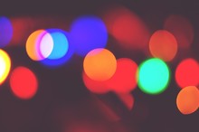 Defocused Image Of Colorful Illuminated Lights At Night