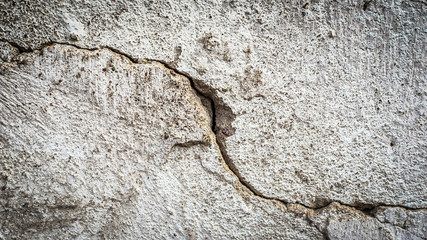 Poster - old stone wall with a crack. texture for design