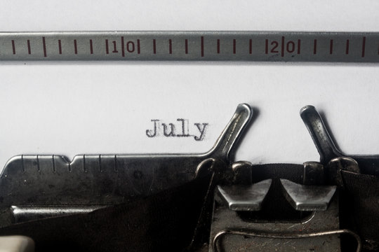 July text written on old typewriter