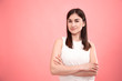 © puhimec - Portrait of a young woman on an isolated pink background.