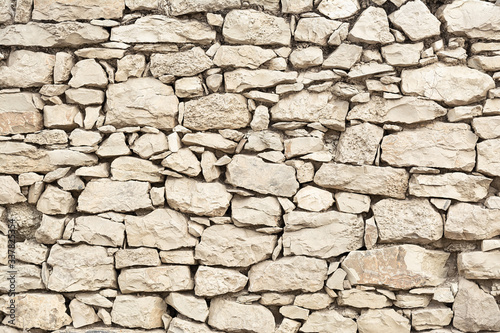Fotografía Wall texture with masonry of beige color