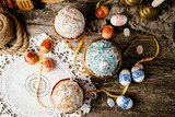 Fototapeta Uliczki - Easter, Easter cake on a wooden background and colored eggs