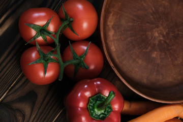 vegetables with an empty clay plate