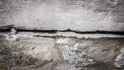 Wall Mural - old stone wall with a crack. texture for design