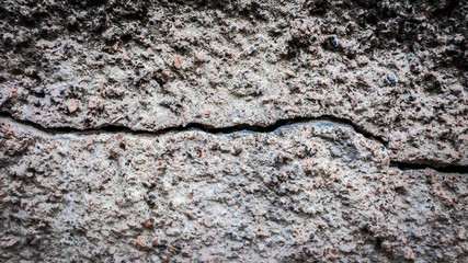Poster - old stone wall with a crack. texture for design
