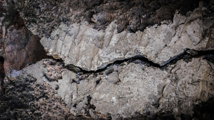 Poster - old stone wall with a crack. texture for design