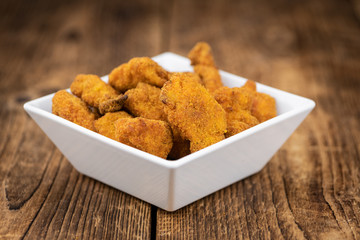 Sticker - Vintage wooden table with fresh made Chicken Nuggets