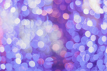 Defocused Image Of Purple Christmas Lights
