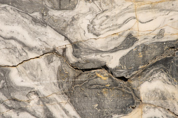 Ancient rocks, material surface, rock background, large marble texture, stone in the cut, age-old traces.