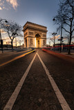 Fototapeta Paryż - World famous Arc de Triomphe at the city center of Paris, France.	