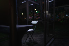 Empty Chairs And Table In Restaurant At Night