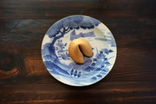 High Angle View Of Fortune Cookie In Plate On Table