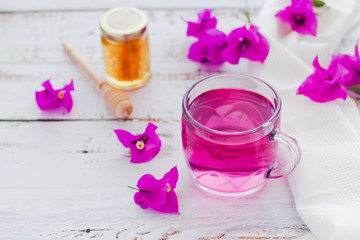 tea of Bougainvillea flowers or te bugambilia with honey and raw flowers and leaves