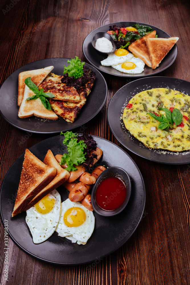 Breakfast food table. Festive brunch set, meal variety with fried egg ...
