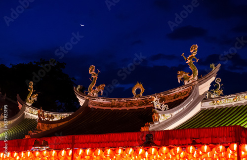 Moon and Chinese temple in the night