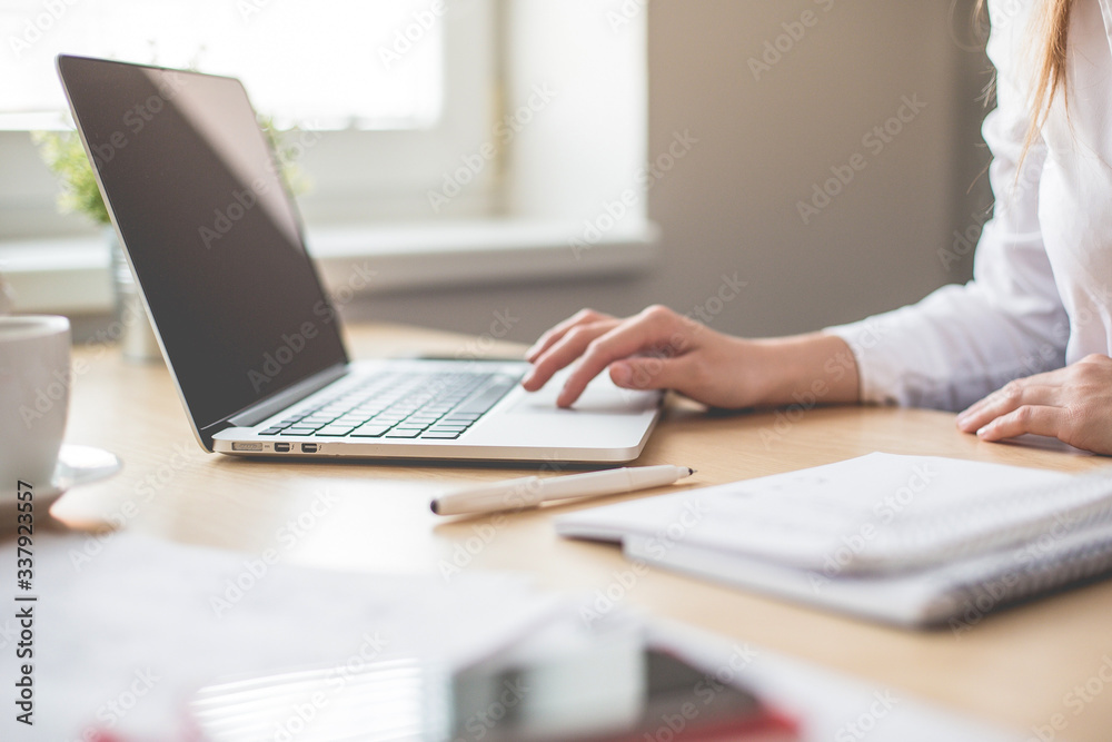 Midsection Of Woman Using Laptop At Office - obrazy, fototapety, plakaty 