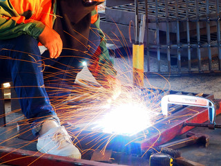 Welding work ,worker with protective welding metal on construction