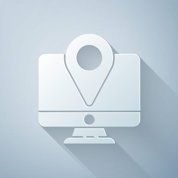 Paper cut Computer monitor and folded map with location marker icon isolated on grey background. Paper art style. Vector Illustration