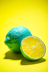 Whole Lemon Fruit and Lemon Slice on Yellow Background. Modern Minimal Food Background