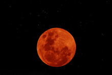 Orange Moon In The Dark Night With Little Stars.