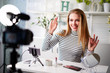 © artiemedvedev - Female beauty blogger showing ok sign with positive emotions. Influencer woman recommends quality of cosmetics in review. Make-up artist opinion leader advertising products to followers of her channel