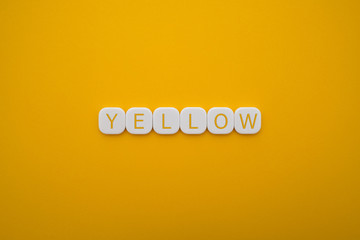 Alphabet YELLOW word block with YELLOW background.