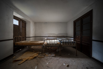 Wall Mural - Dark and scary bedroom of an abandoned house